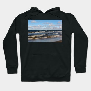 White cumulus clouds in sky over wavy Baltic sea Hoodie